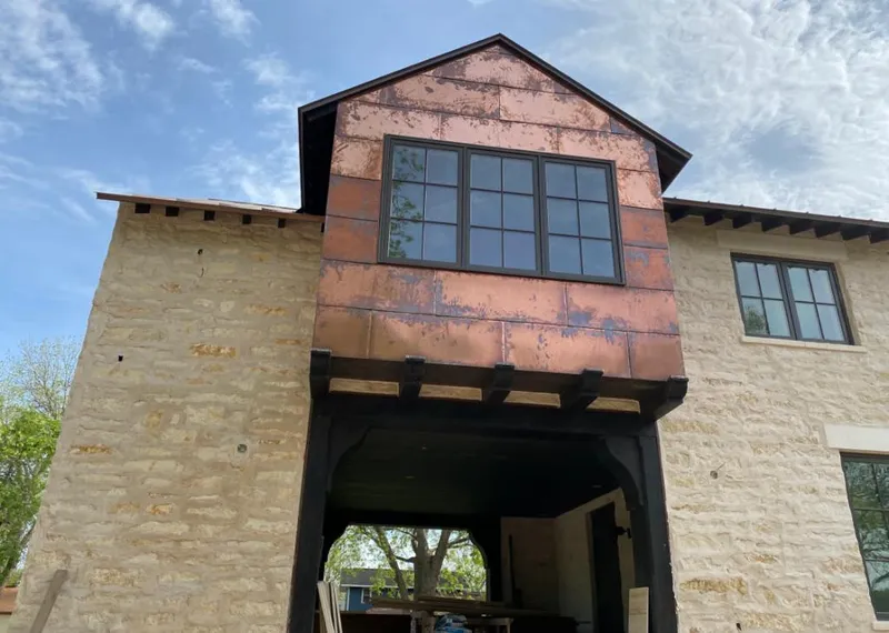 Copper metal panel facade on a stone building for Metal Roof Coating in San Angelo
