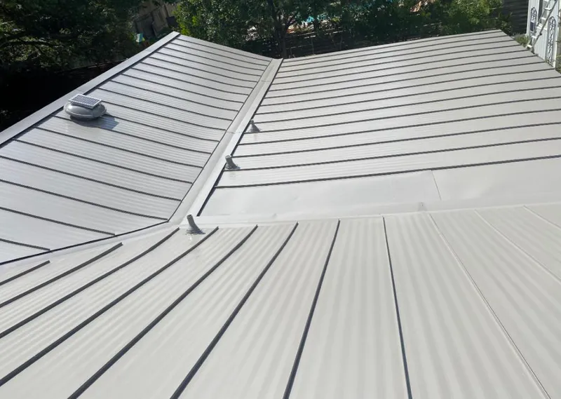 Solar attic fan installed on a metal roof for Roof Ventilation in San Angelo